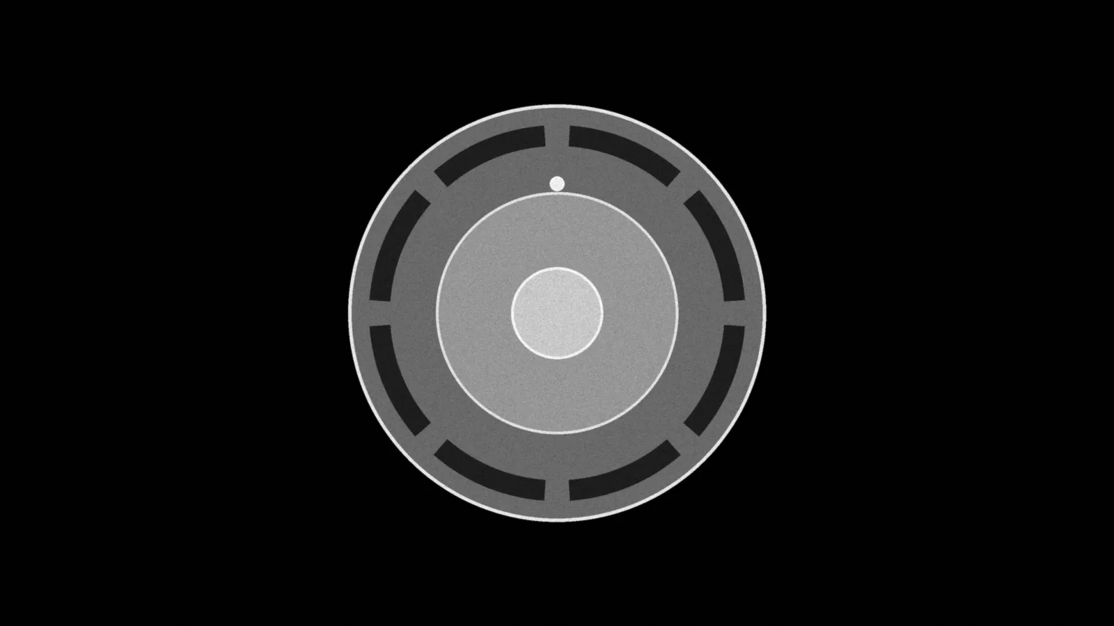 Illustration: a round ceiling smoke alarm seen face-on, vent slots around a center test button, in grey on black.